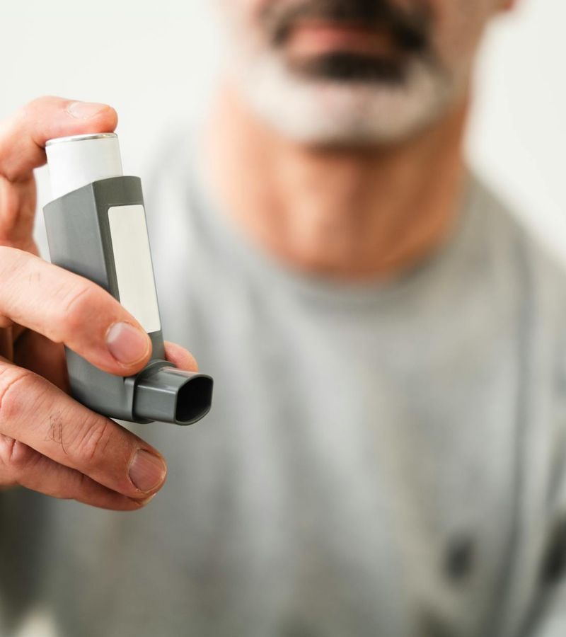 Close-up of a man's chest expanding as he takes a deep breath.