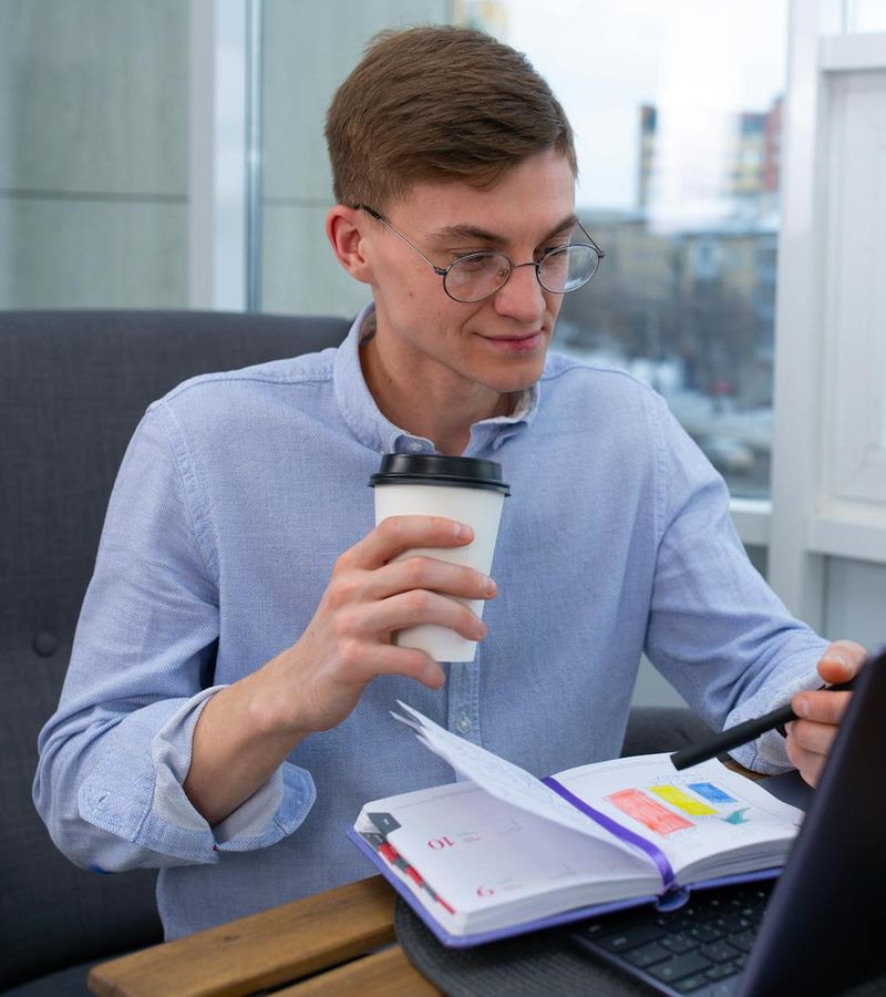 Man looking at his watch, planning his workout schedule.