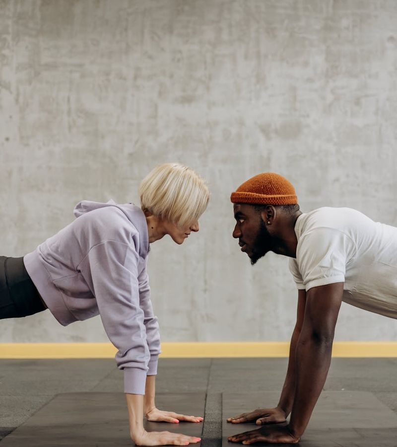 Man stretching before a workout, showing concentration and readiness.